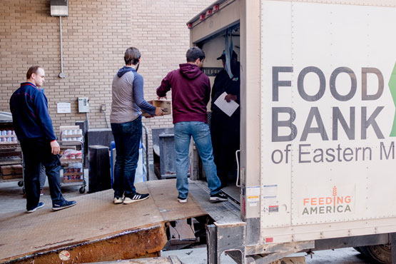 Social Work students helping to unload a Food Bank of Eastern Michigan truck.