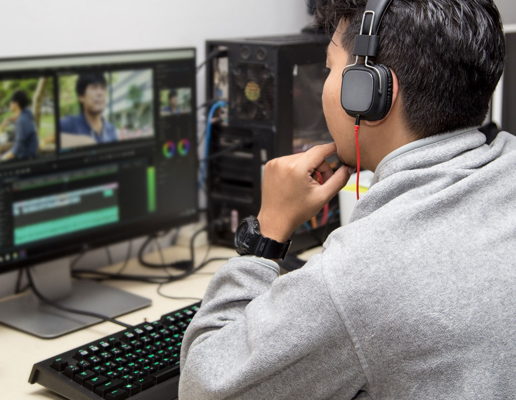 Video editor working on a computer
