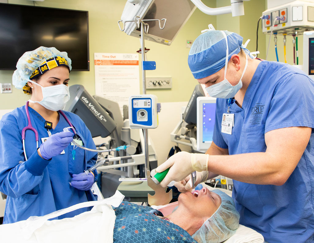 Two medical workers in an operating room.