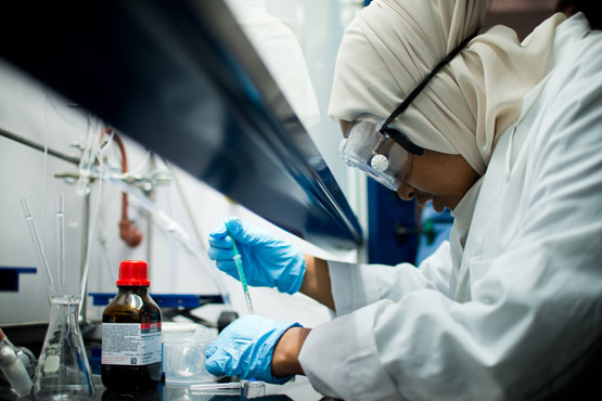 Student conducting research in a lab.
