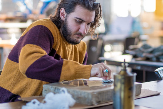 Student in a printmaking class at the University of Michigan-Flint.