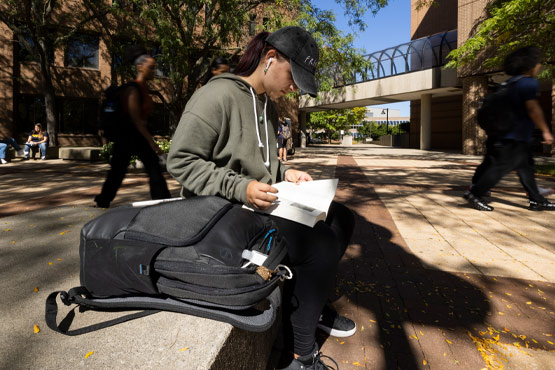 Student studying outside.