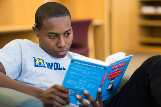 Student reading in the library.