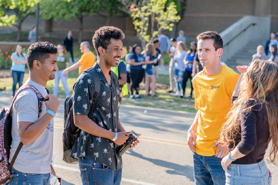 Group of students talking outside