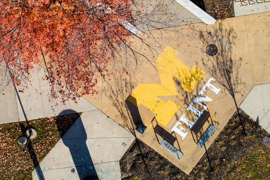 UM-Flint logo outside on campus