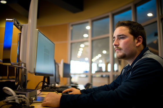 Student working on computer.