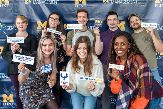 UM-Flint School of Management students at a SOM event.