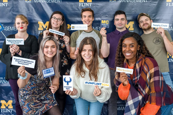UM-Flint School of Management students at a SOM event.